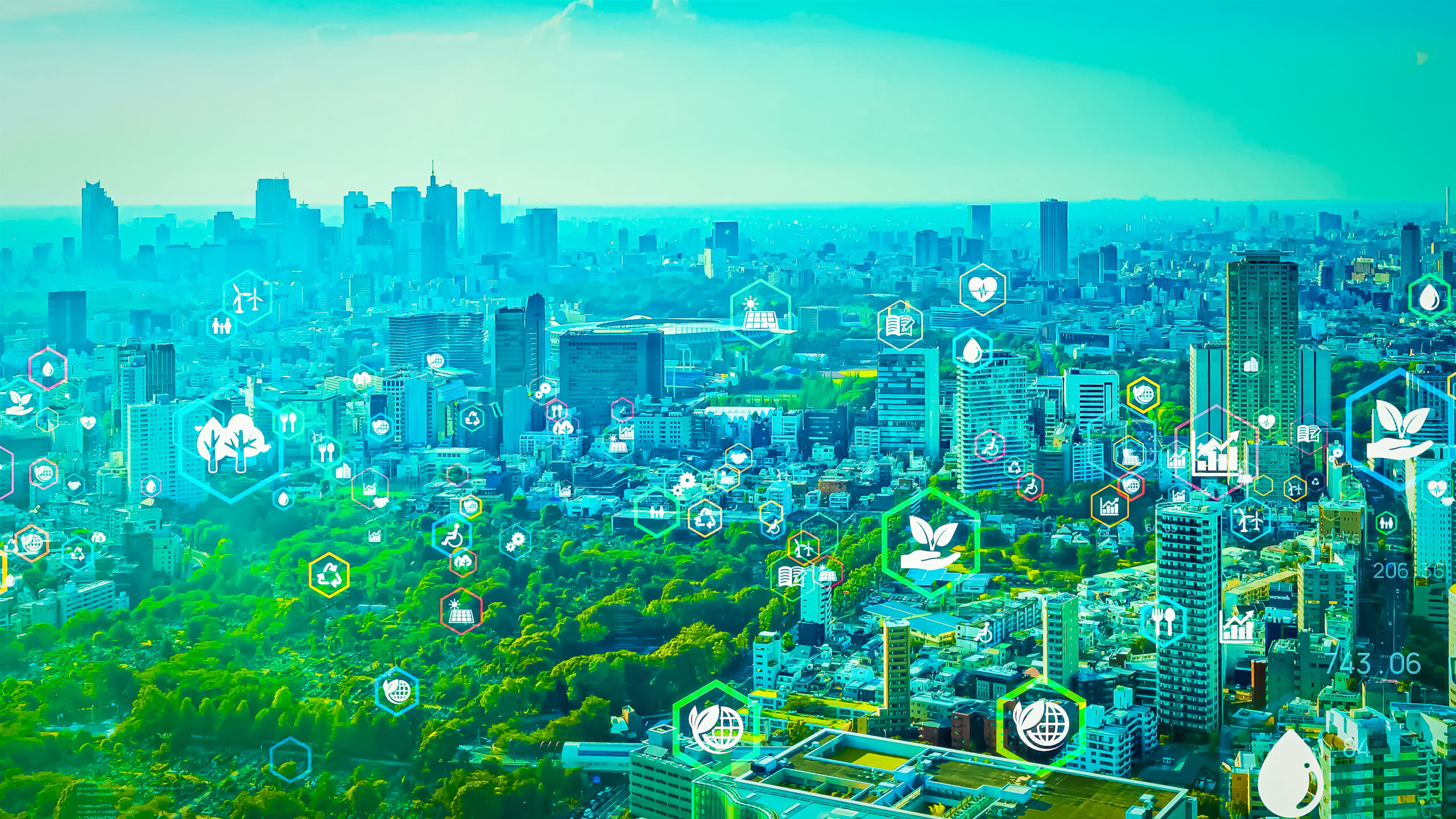 City skyline with digital icons symbolising sustainable, connected infrastructure